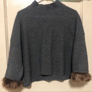 Loose fitting sweater.